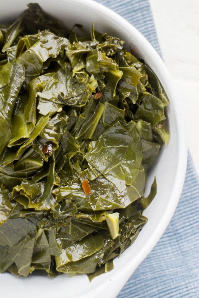Easy Vegetarian Collard Greens recipe, these are the best! Collard greens are simmered in a brown sugar vegetable broth making them full of flavor!  Only 68 calories a serving!