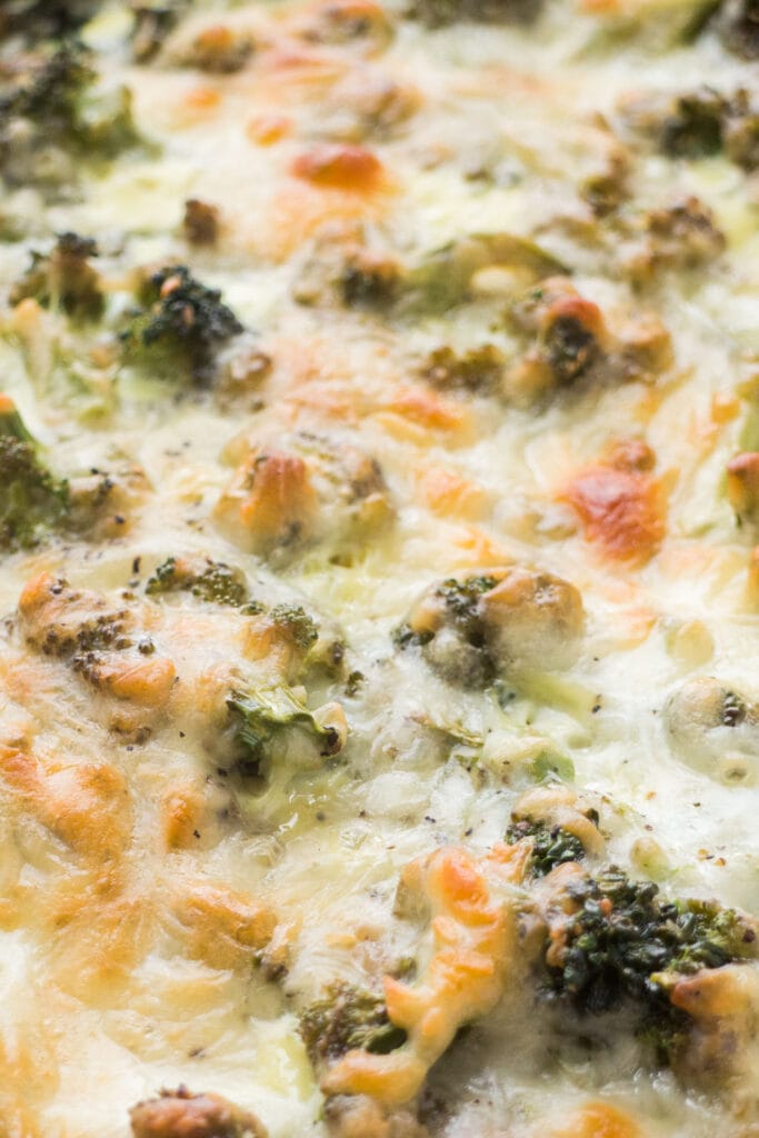 closeup of broccoli and cheese quiche.