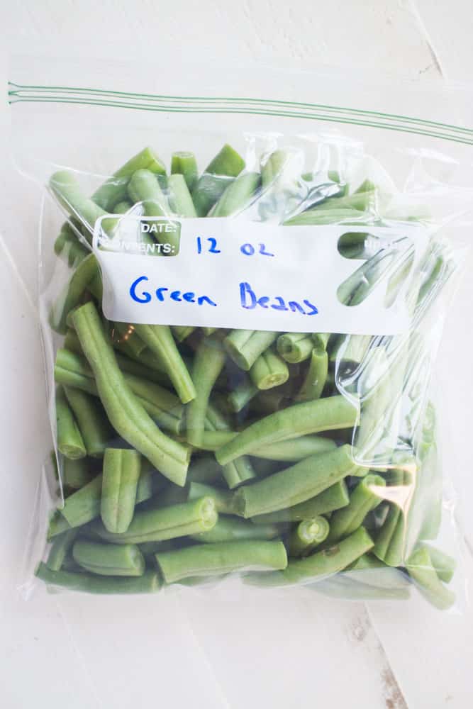 Easy step by step instructions on how to freeze fresh green beans without blanching.  These green beans will last up to a year. You can use them in casseroles, soups, stir fry and more!