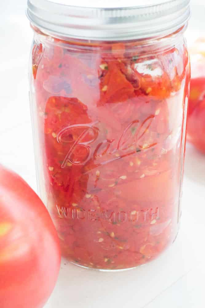 These Italian Diced Tomatoes are marinated overnight with spices for full flavor. Unlike other diced tomato recipes no boiling, water bath or peeling is needed! 