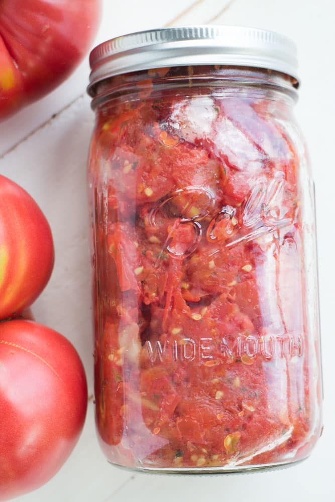These Italian Diced Tomatoes are marinated overnight with spices for full flavor. Unlike other diced tomato recipes no boiling, water bath or peeling is needed! 