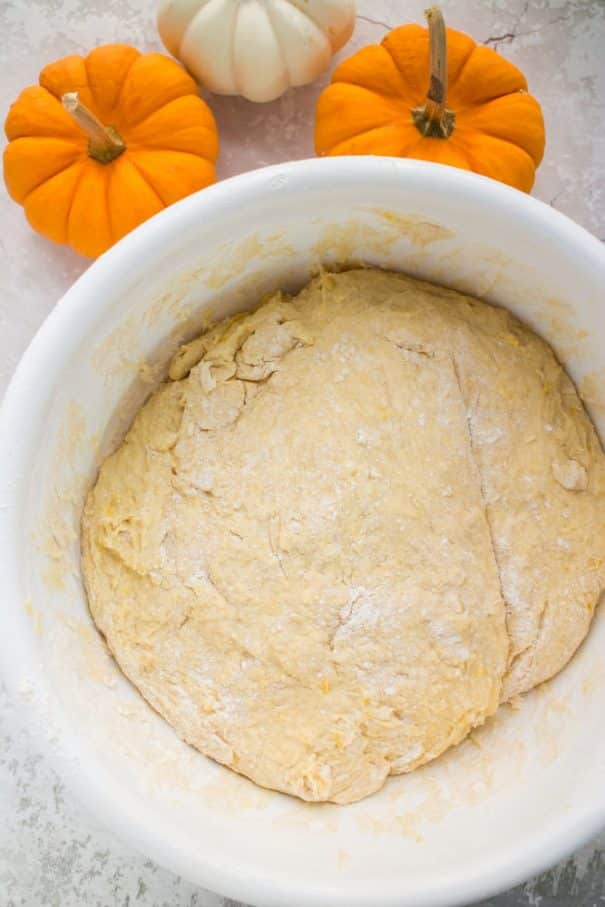 These Pumpkin Dinner Rolls are so soft and fluffy and easier than you might think! You’ll love how delicious they are with just the right amount of pumpkin flavor. They are my go-to fall dinner roll recipe and they are perfect for Thanksgiving and other holiday dinners.