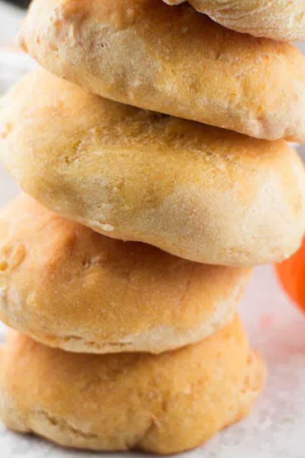 These Pumpkin Dinner Rolls are so soft and fluffy and easier than you might think! You’ll love how delicious they are with just the right amount of pumpkin flavor. They are my go-to fall dinner roll recipe and they are perfect for Thanksgiving and other holiday dinners.