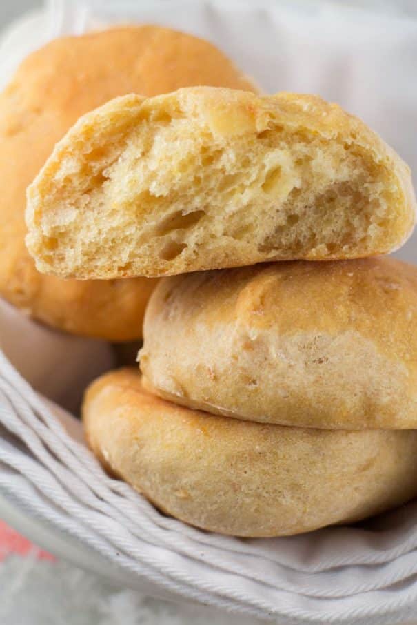 These Pumpkin Dinner Rolls are so soft and fluffy and easier than you might think! You’ll love how delicious they are with just the right amount of pumpkin flavor. They are my go-to fall dinner roll recipe and they are perfect for Thanksgiving and other holiday dinners.