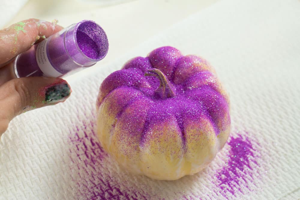 How to Make Rainbow Glitter Pumpkins. Follow these easy step by step instructions to add neon color to Halloween! 