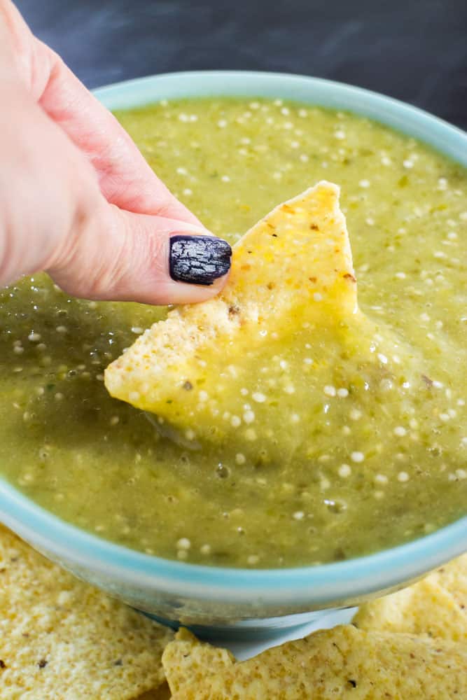 This easy recipe for Roasted Tomatillo Salsa Verde is packed with flavor and creaminess thanks to roasted tomatillos, onion and jalapeños! Learn how to make homemade roasted tomatillo salsa to serve with chips, tacos, enchiladas and more. Whole30, paleo, vegan, and gluten-free.
