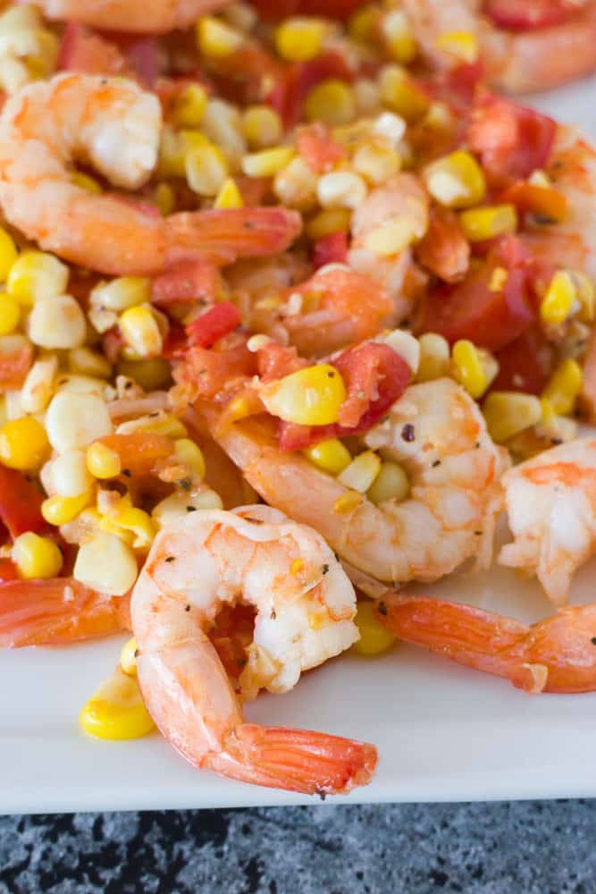 Easy to make Shrimp, Tomato & Corn Salad that is ready in 15 minutes. This is perfect to serve for dinner over pasta, as a appetizer or a light lunch.