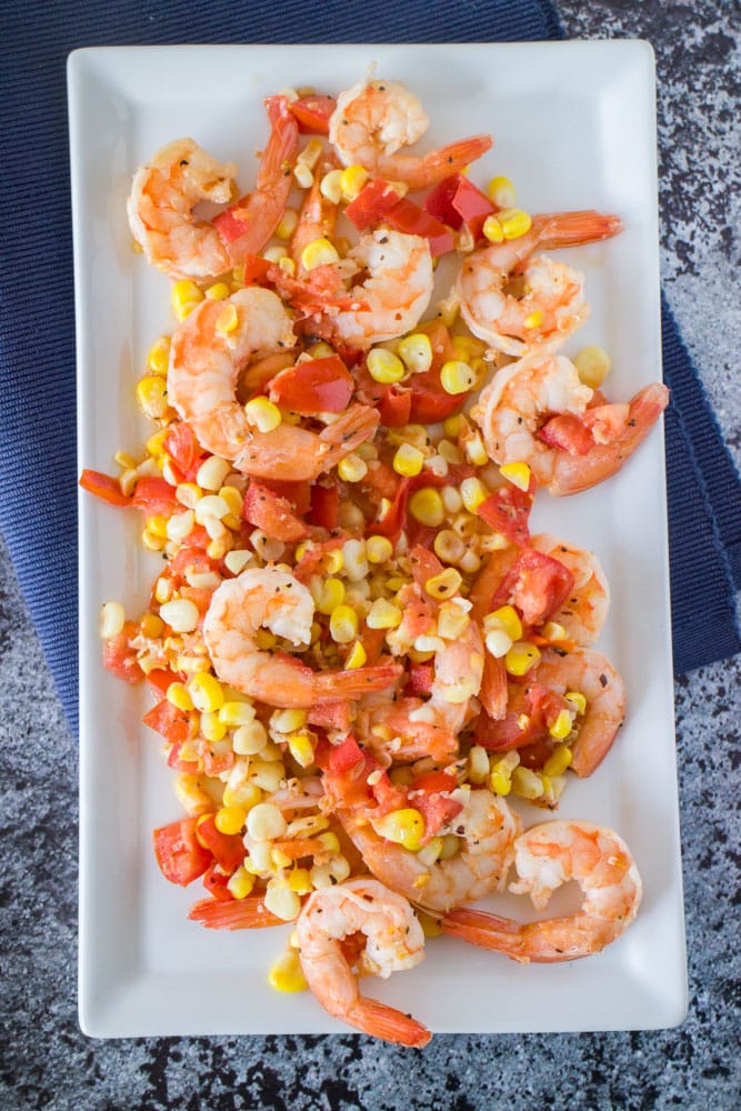 Easy to make Shrimp, Tomato & Corn Salad that is ready in 15 minutes. This is perfect to serve for dinner over pasta, as a appetizer or a light lunch.