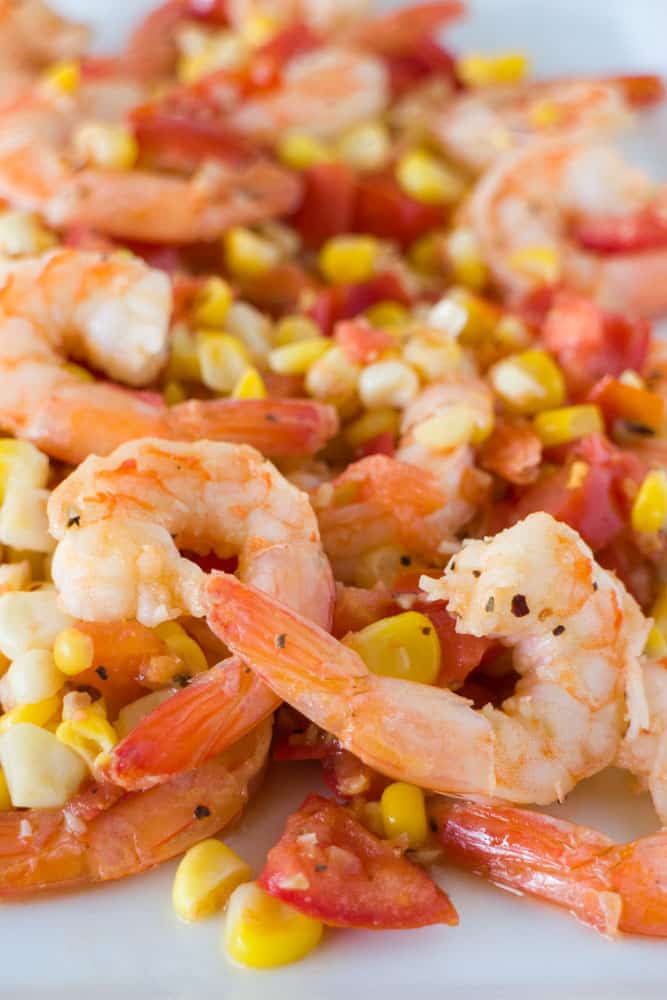 Easy to make Shrimp, Tomato & Corn Salad that is ready in 15 minutes. This is perfect to serve for dinner over pasta, as a appetizer or a light lunch.