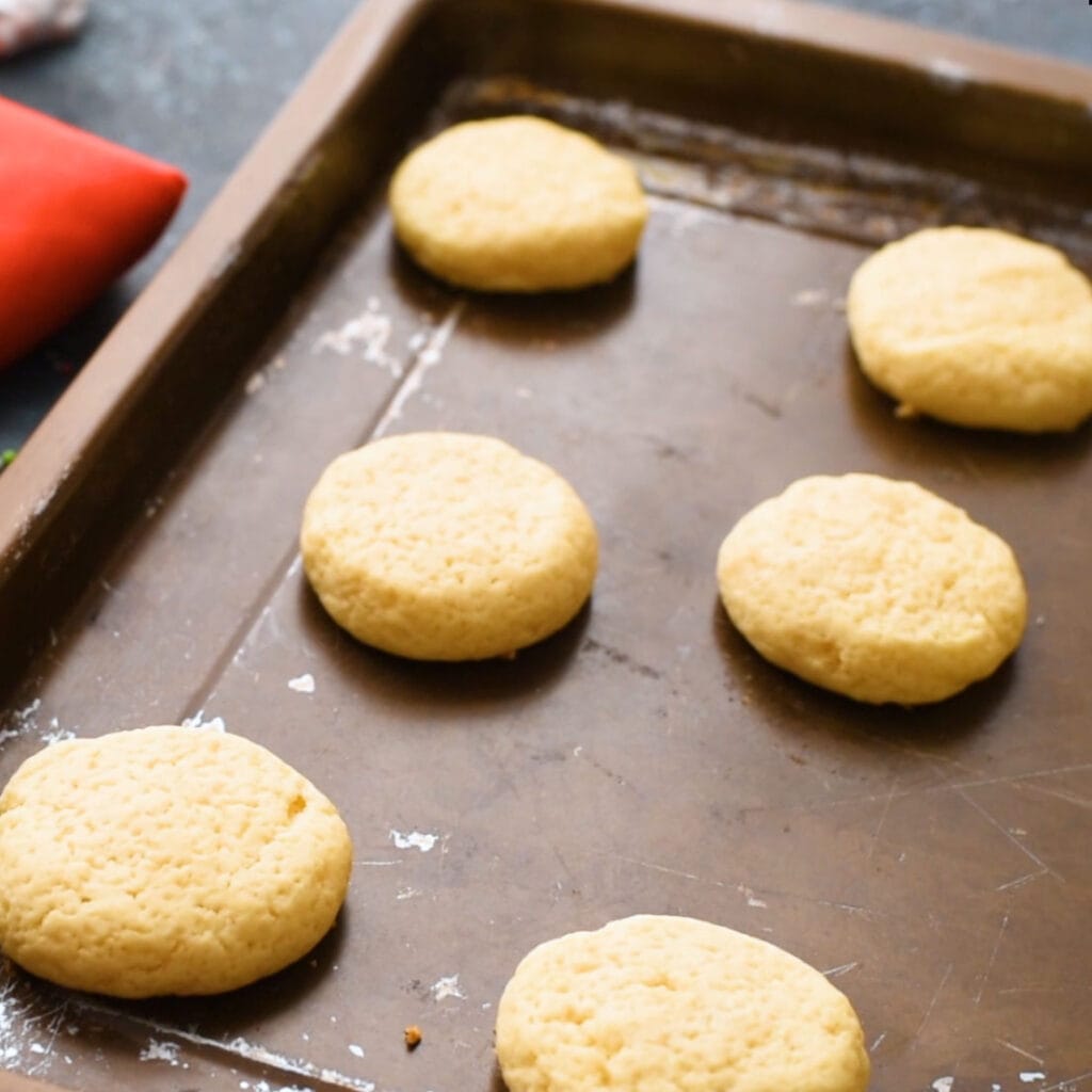 baked sugar cookies on baking sheet.