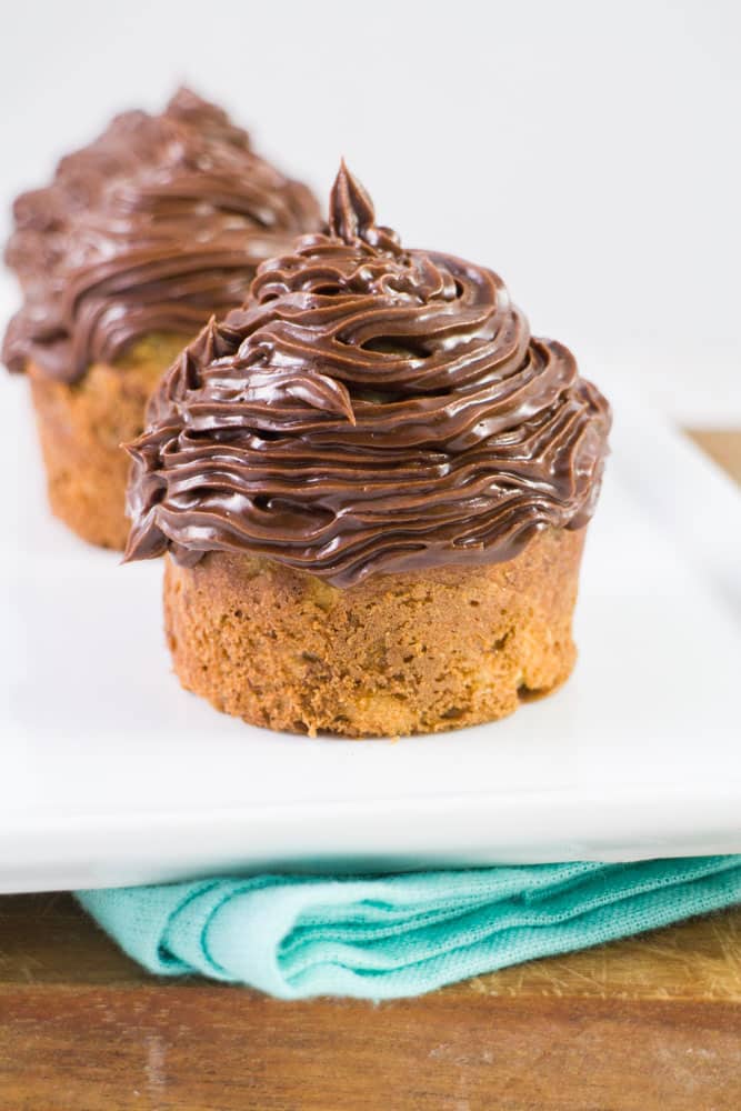 BANANA BREAD Chocolate Muffins with CHOCOLATE Frosting! This easy recipe is made with 3 bananas (that makes it healthy, right?) and tastes just like banana bread! These muffins are moist and extra soft! My family says these are THE BEST banana dessert! 