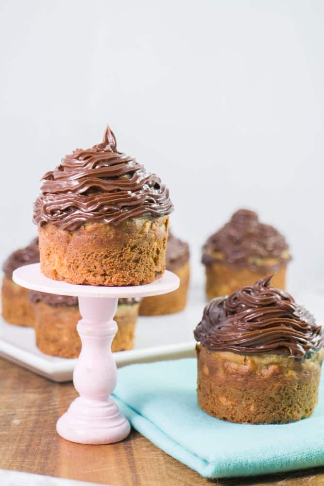 Delicious Banana Bread Muffins that are topped with Chocolate Frosting! These are made with 3 whole bananas and taste just like baked banana bread!