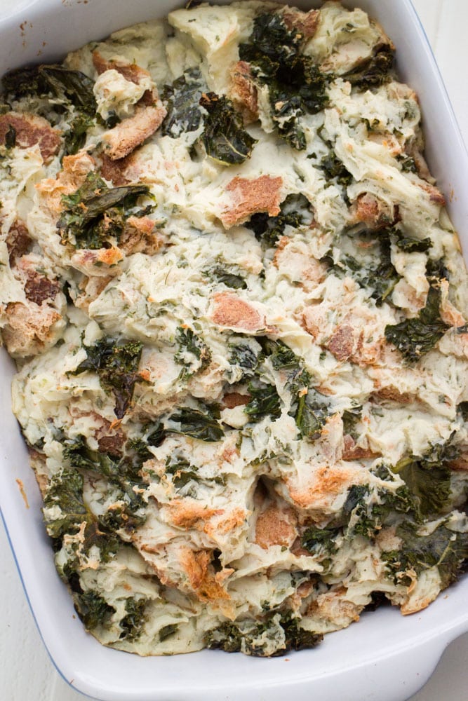 This Potato Kale Stuffing is a comfort food recipe that goes perfect with a turkey, chicken or pork chops. It’s simple to make because it’s made with instant potatoes! Potato Kale Stuffing is also always requested at Thanksgiving! The perfect hearty side dish for your holiday meal.