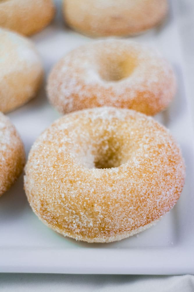 Homemade Baked Sugar Donuts recipe that is easy to make and ready in 15 minutes. These simple and extra soft donuts taste just like sugar donuts from your favorite bakery! 