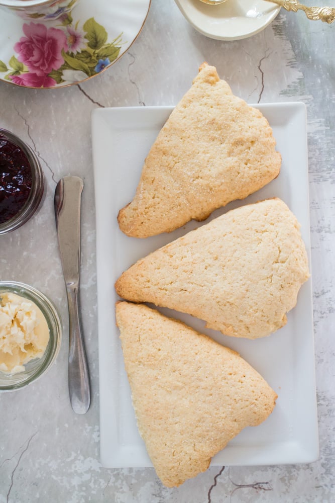 You only need one bowl for this Easy Scones Recipe! The secret to this homemade recipe is sour cream which makes light scones!  Serve these crumbly English soft scones with clotted cream, jam and tea!  You can add blueberry or raspberry to them to make them berry flavored! 