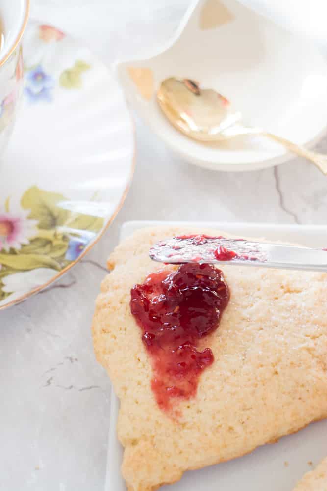 You only need one bowl for this Easy Scones Recipe! The secret to this homemade recipe is sour cream which makes light scones!  Serve these crumbly English soft scones with clotted cream, jam and tea!  You can add blueberry or raspberry to them to make them berry flavored! 