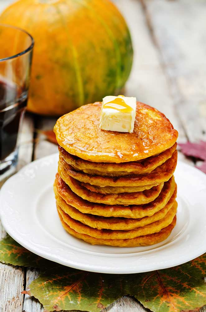 EASY FLUFFY Pumpkin Pancakes recipe! These delicious extra fluffy pancakes made from scratch are low carb and packed with protein (1/2 cup pumpkin!). They make a healthy substitution instead of buttermilk pancakes. My family considers them "the best pumpkin pancakes in the world!".