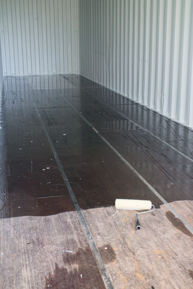 How to remodel a shipping container's floor to make it move in ready. Find out how to easily refinish the floors on a budget to turn it into your modern dream home! Great design inspiration and cost info for your shipping container house! 