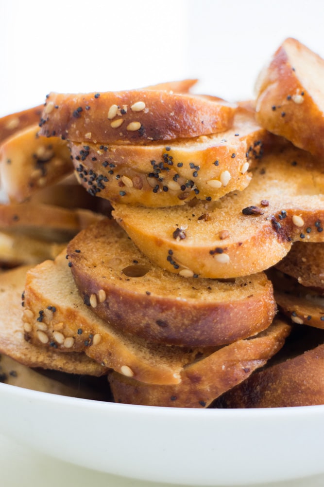 CRUNCHY homemade Everything Bagel Chips! This recipe is easy to make and only requires 3 ingredients! These DIY NYC bagel chips are perfect for snacks and appetizers! Save money and start making your own crispy Bagel Chips! 