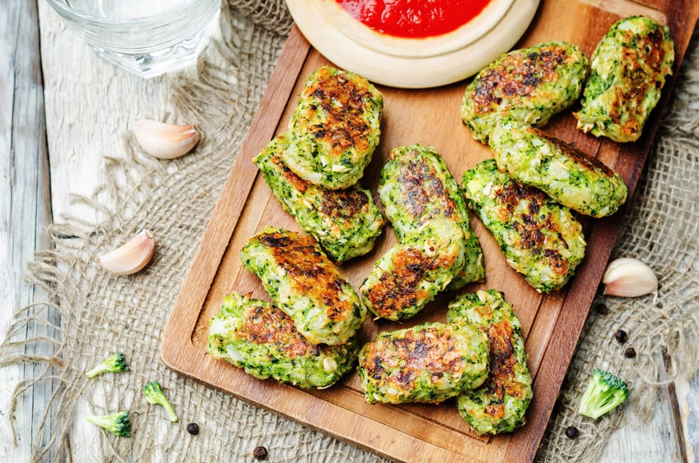 Baked Broccoli and Cheese Sticks recipe is easy to make and only uses 5 ingredients. This delicious snack food is perfect to serve as a party appetizer or snack!  Your kids are going to love these easy cheesy broccoli bites!