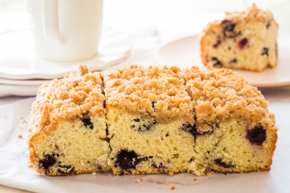 Easy to make Blueberry Buckle that tastes just like Coffee Cake!   This old fashioned cake recipe has a yummy cinnamon streusel topping that my family thinks is the best!  Enjoy for breakfast or dessert.  Made in a 8x8 pan, but can be doubled in a 9x13. 