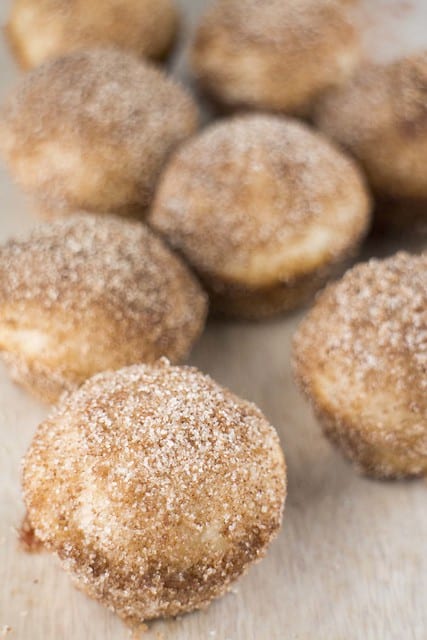 JELLY FILLED donut muffin holes are AMAZING! These baked donut holes are easy to make and are rolled around in delicious cinnamon sugar! These homemade treats taste just like Dunkin' Donuts Munchkins but are much healthier! 
