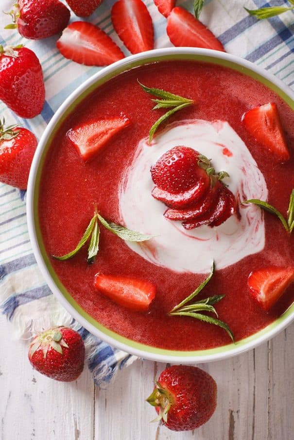 Eat HEALTHY with this Strawberry Soup! This simple Summer time meal recipe uses fresh strawberries and yogurt to make a creamy chilled strawberry soup!  Each serving is only 205 calories!