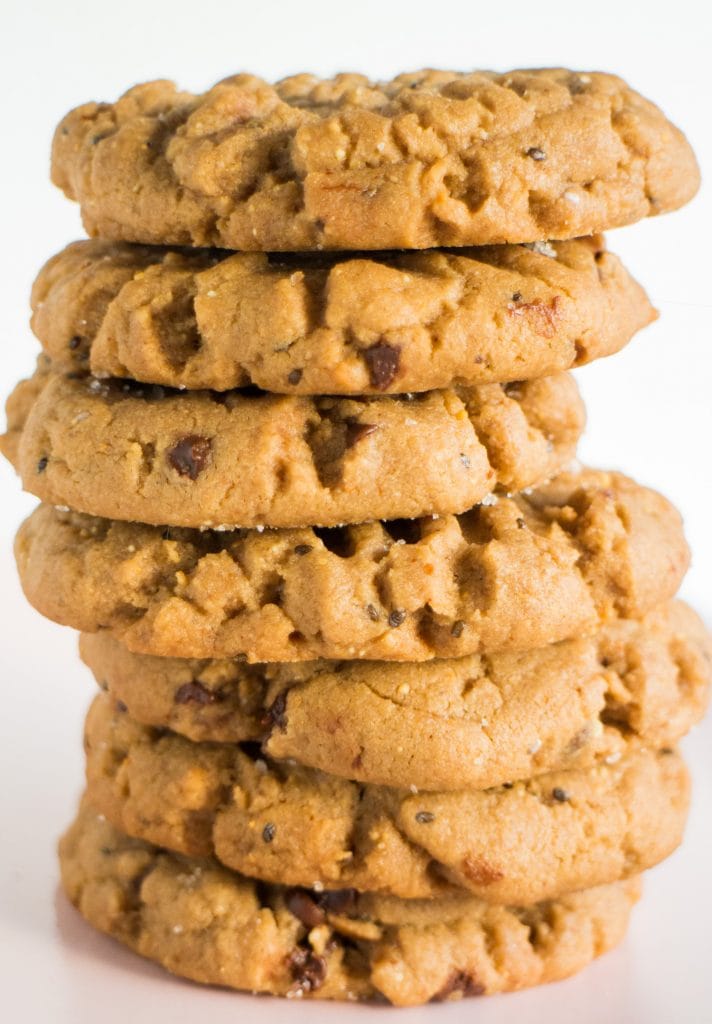 stack of peanut butter protein cookies on table.