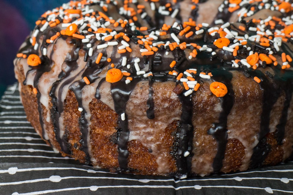 Root Beer Halloween Bundt Cake recipe!  This cake is easy to make and is so moist inside! I decorate it with a black sugar glaze and sprinkles on top for Halloween!  It's easy to use this recipe for a Christmas bundt cake too!