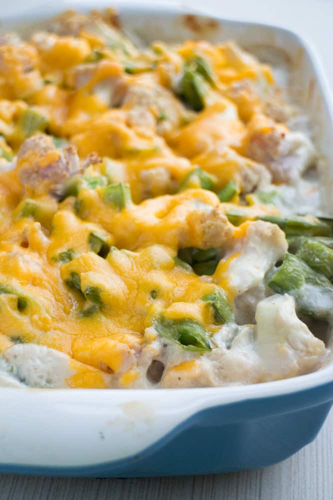 CHEESY Sugar Snap Pea and Cauliflower Casserole! This loaded recipe is simple to make with fresh vegetables and cream of mushroom soup. I love serving this easy to make casserole as a chicken side dish or a vegetarian main dish. During the Summer I always use fresh cauliflower and sugar snap peas straight from the garden!