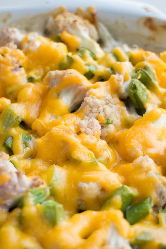 CHEESY Sugar Snap Pea and Cauliflower Casserole! This loaded recipe is simple to make with fresh vegetables and cream of mushroom soup. I love serving this easy to make casserole as a chicken side dish or a vegetarian main dish. During the Summer I always use fresh cauliflower and sugar snap peas straight from the garden!