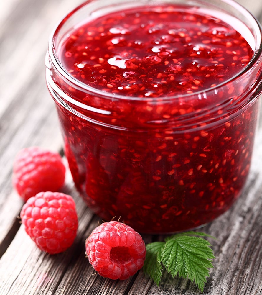 Easy 10 Minute Raspberry Jam recipe! This healthy homemade recipe uses 1 pint of fresh raspberries, honey and lemon juice. NO pectin or sugar required!  I always make 2 jars - one to store in the refrigerator and one to store in the freezer! 