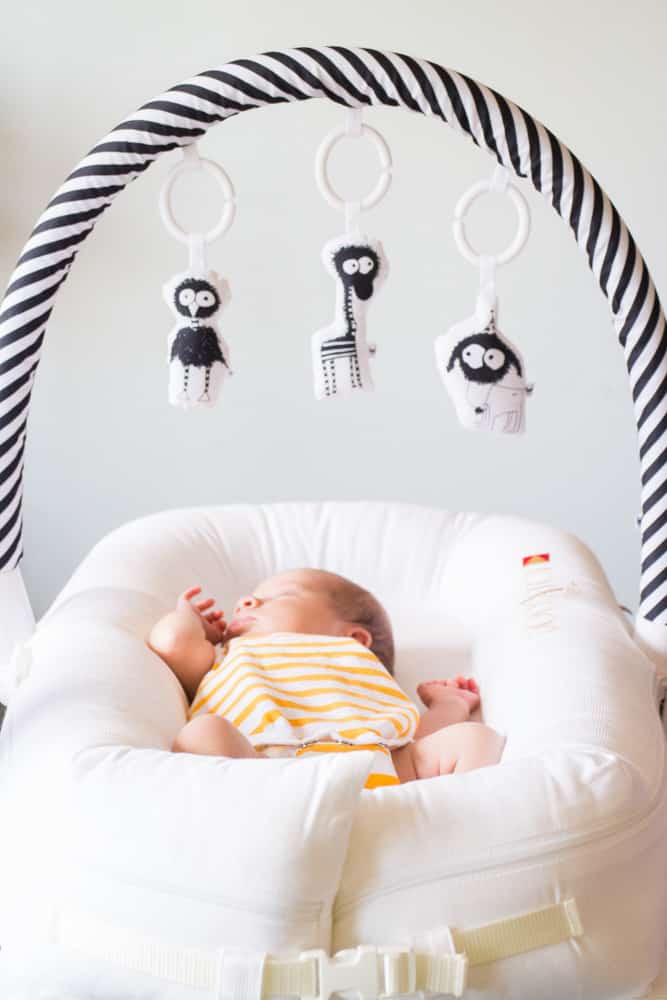 First Time Mom Review of the DockaTot and how we use it as a lounger and travel sleeper. Our baby loves napping with DockaTot!