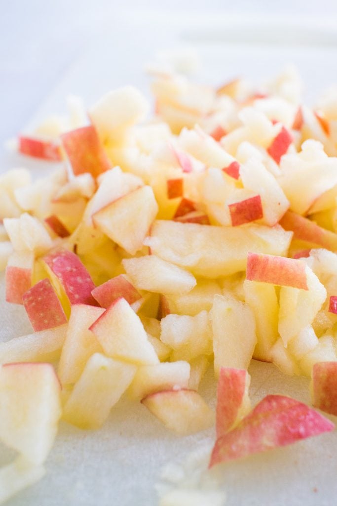 diced apples on cutting board.