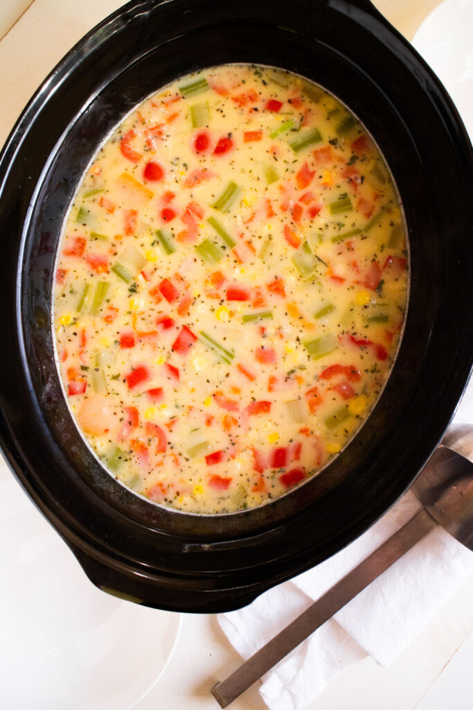 cooked creamy soup in slow cooker.