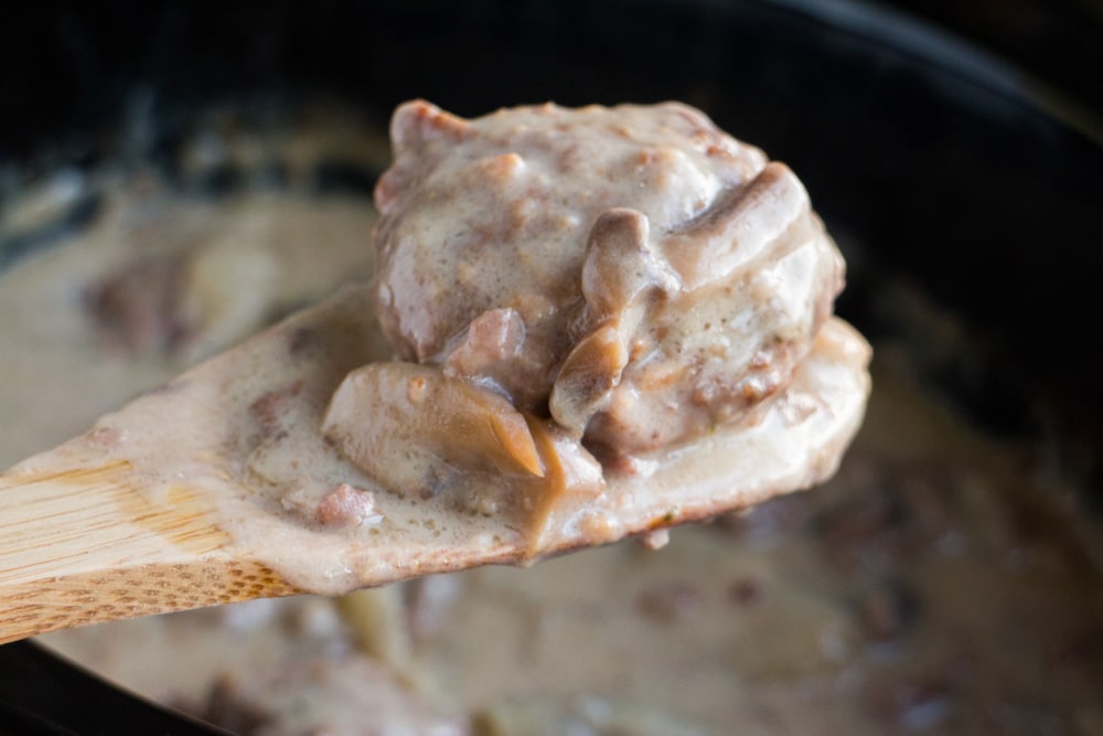 I LOVE this SLOW COOKER Salisbury Steak With Cream of Mushroom Soup! This CROCKPOT recipe is easy to make and is ready in 5 hours! It's made with dry onion soup mix and cream of mushroom soup to make a comforting gravy your entire family is going to love! I always serve on egg noodles or with mashed potatoes! This is one of my favorites simple weeknight meals!