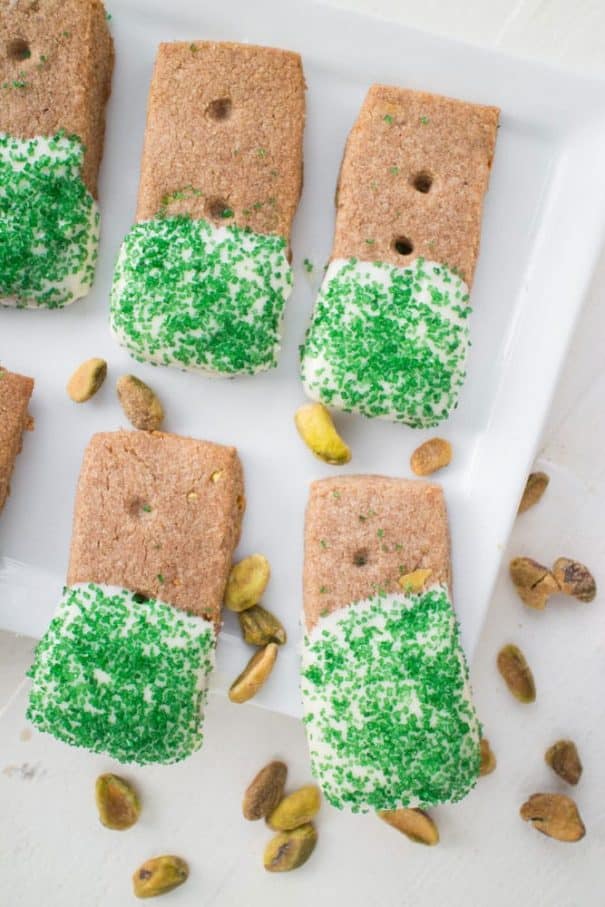 GLUTEN-FREE White Chocolate Dipped Pistachio​ ​​Cookies​ are the BEST for CHRISTMAS baking! This easy gluten-free recipe makes 48 spiced pistachio cookies that are dipped in melted white chocolate! They are made with almond flour and teff flour, making a perfectly formed cookie! They are one of my favorite Christmas cookies, perfect for family eating and holiday gifts! 