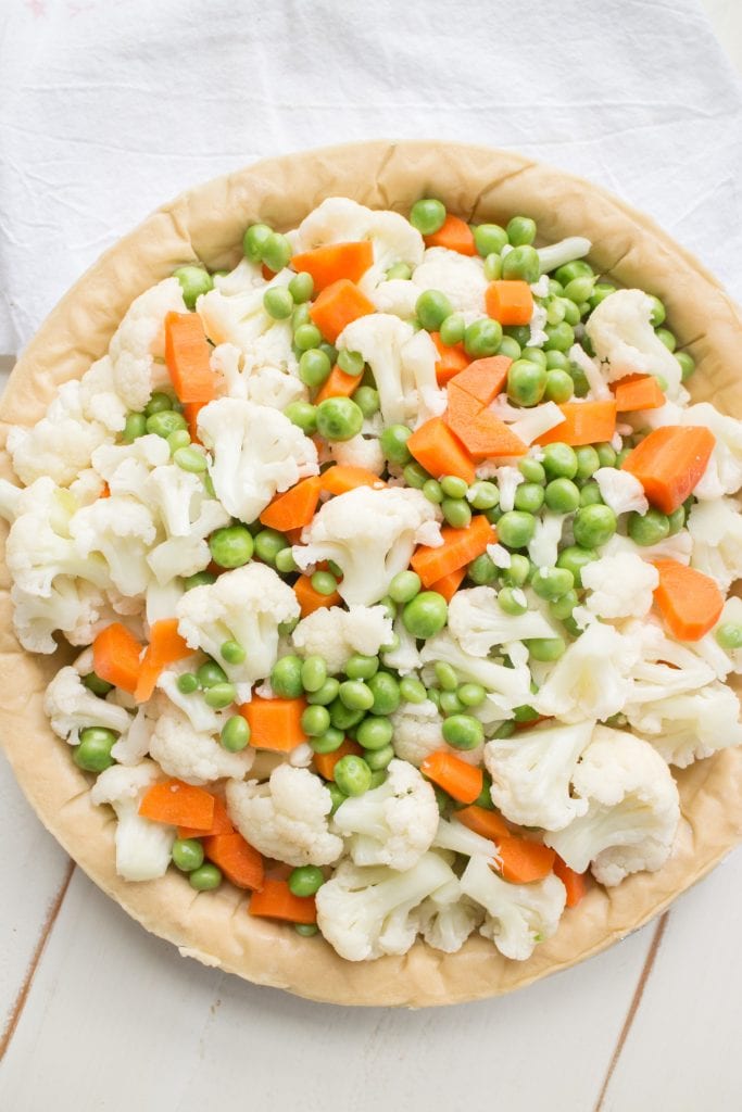 cauliflower, peas and carrots in pie crust.