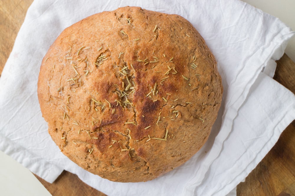 Homemade Whole Wheat SLOW COOKER Bread recipe that's so easy to make! This simple recipe is made in the crock pot and uses honey instead of sugar. This bread is healthy and great for clean eating! Use it for sandwiches or for breakfast, I love mine with a little butter and jam!
