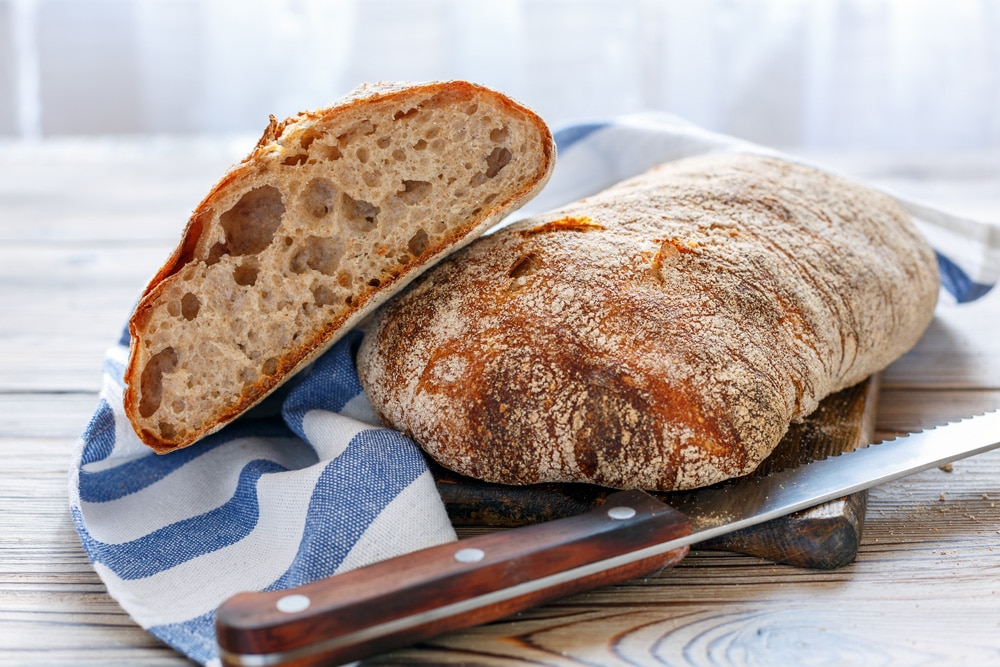 Ciabatta bread recipe! This homemade bread is crusty and filled with holes! It's easy to make in the bread machine. Serve it for sandwich, soup or a dinner side dish!