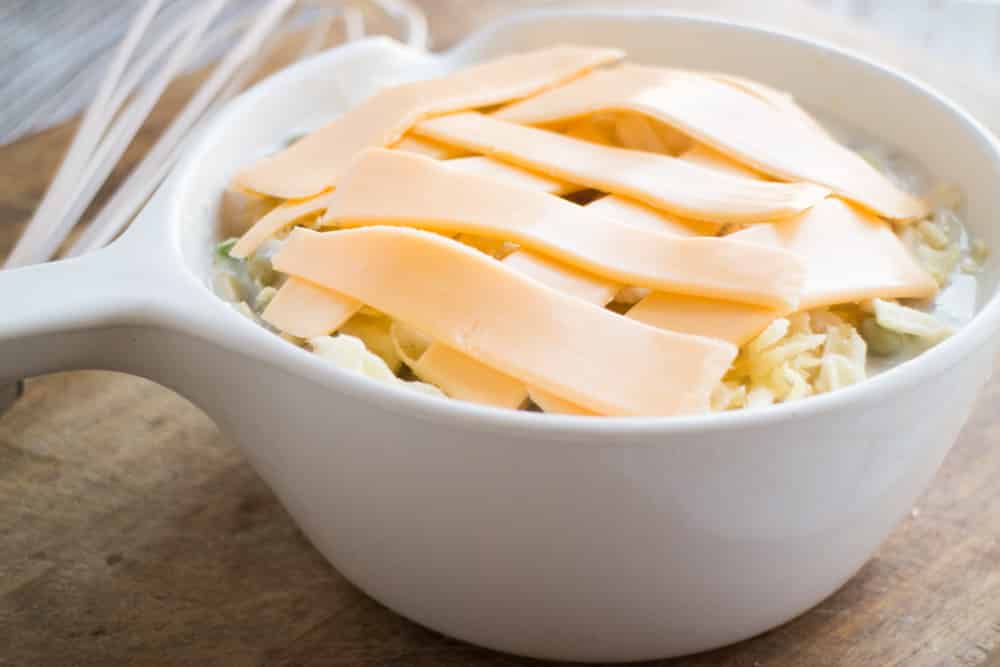 Grandmas Tuna and Chips Dip recipe, just like Grandma used to make it! This creamy tuna dip is made with Cream of Mushroom Soup and American cheese slices with crushed up potato chips on top! This is a classic Midwestern family recipe!
