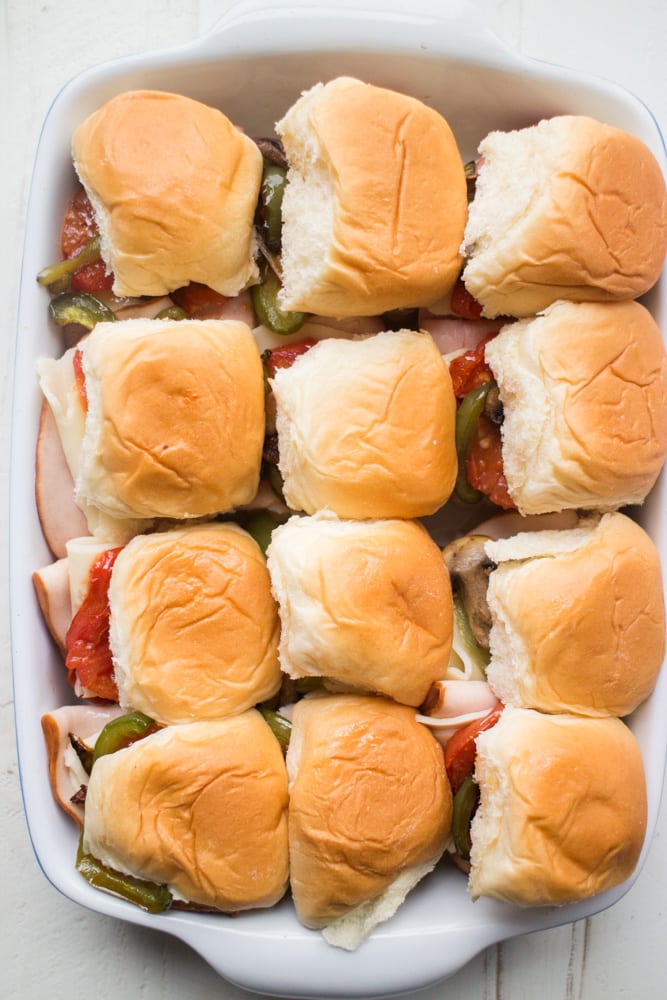 ITALIAN Ham and Turkey Sliders with ROASTED Vegetables on Hawaiian Sweet Rolls! This mini sandwich recipe is so easy to make and makes the perfect meal for dinner, potlucks and party finger foods! 