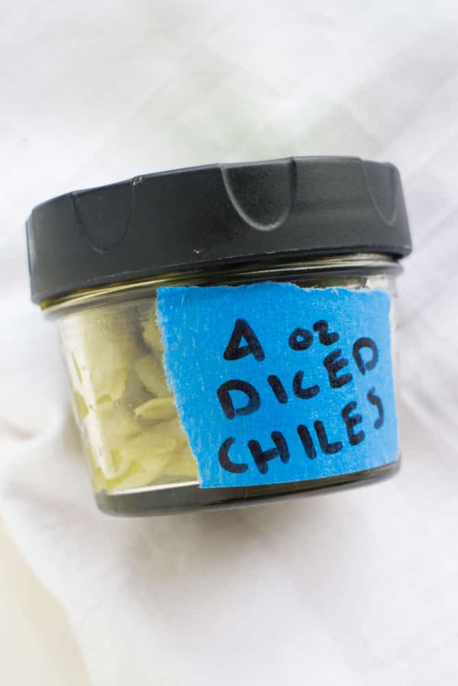 How to make DICED GREEN CHILES - just like the canned version you buy in the supermarket! SO EASY step by step instructions to make homemade green chiles! Perfect idea for your garden Anaheim peppers! Serve immediately, freeze or can them!