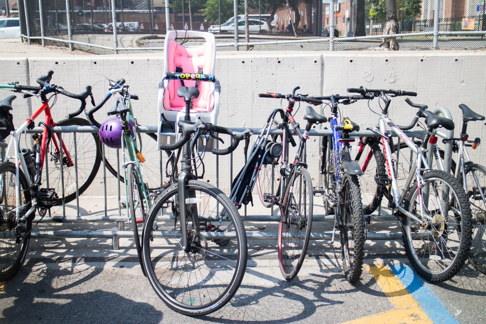 Full guide on bike riding with a baby! We started riding in NYC with our baby at 10 months old. Learn about the best baby bike seat, baby helmet and how to stay safe when cycling. 