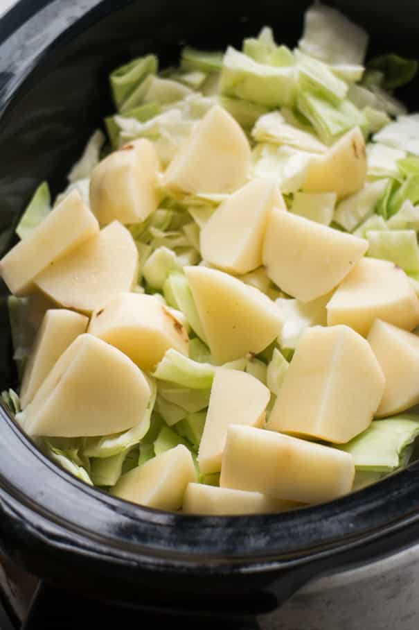 Slow Cooker Sausage and Cabbage is a easy crock pot recipe ready in 6 hours! Add Sweet Italian Sausage links and vegetables into your slow cooker for a delicious comfort meal!