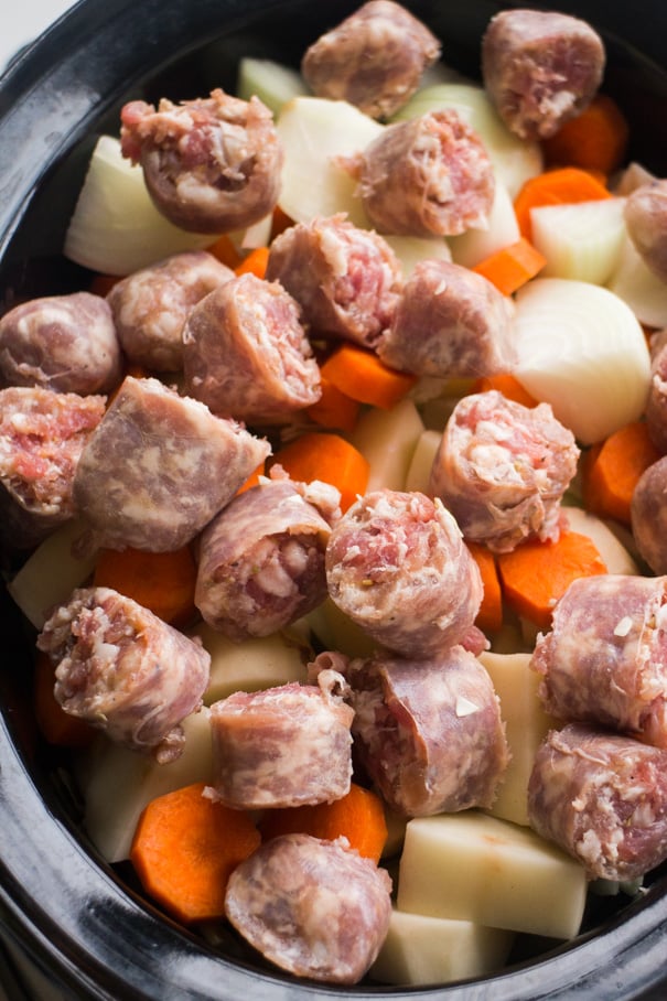 sausage and vegetables in slow cooker.