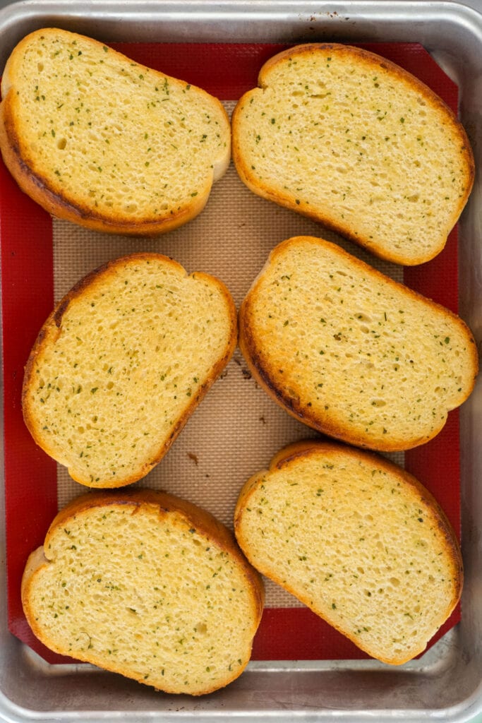 cooked texas toast in baking pan.