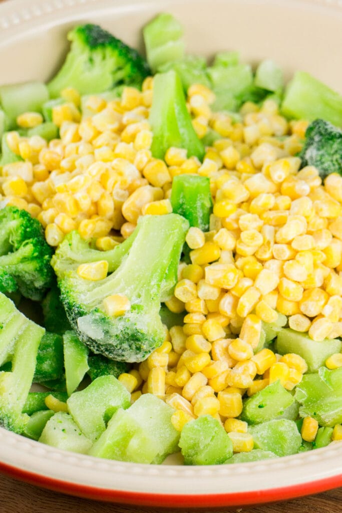 frozen broccoli and corn in baking dish.
