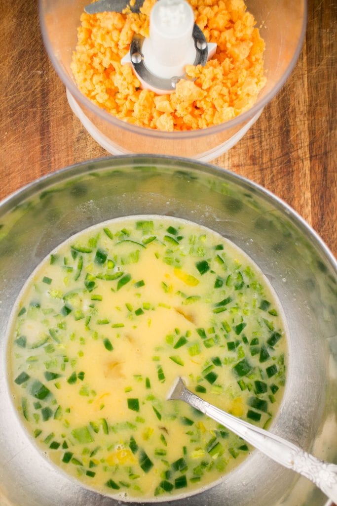 eggs and peppers in mixing bowl with fork