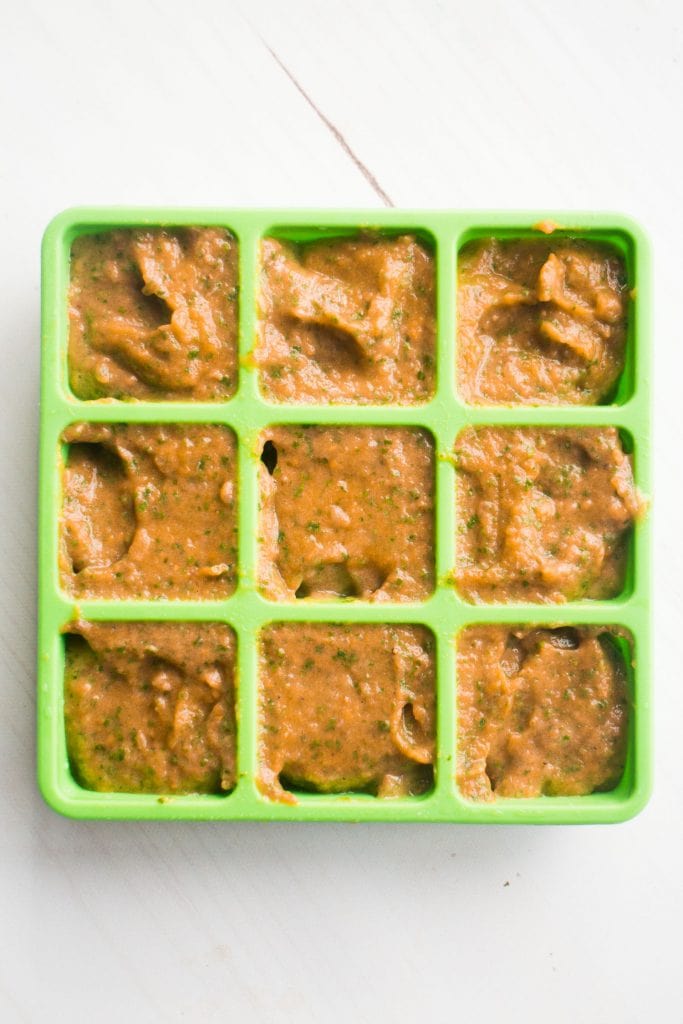 homemade baby food puree in ice cube trays to freeze.